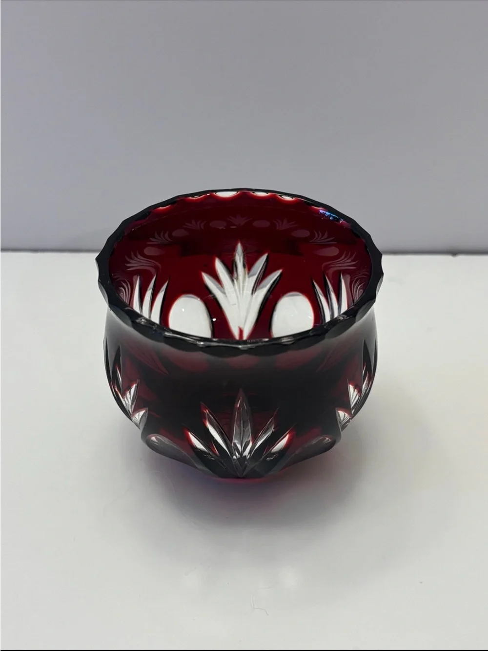 Bohemian Red Crystal glass votive candle holder features intricate cut-to-clear